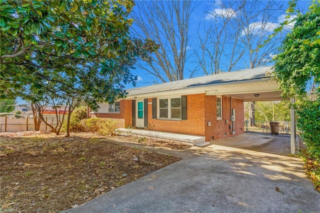 ranch-style house with a carport