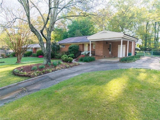 605 Westchester Dr, High Point, NC 27262 - ranch-style house with aphalt driveway, fence, brick siding, a front lawn, and an attached carport