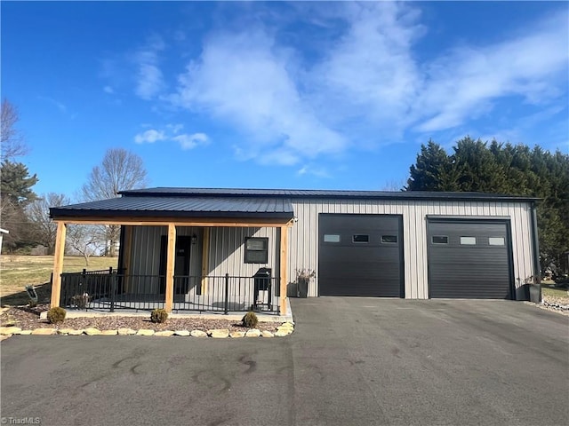 view of front of home with a garage and a porch