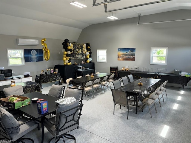 dining room with lofted ceiling and a wall mounted AC