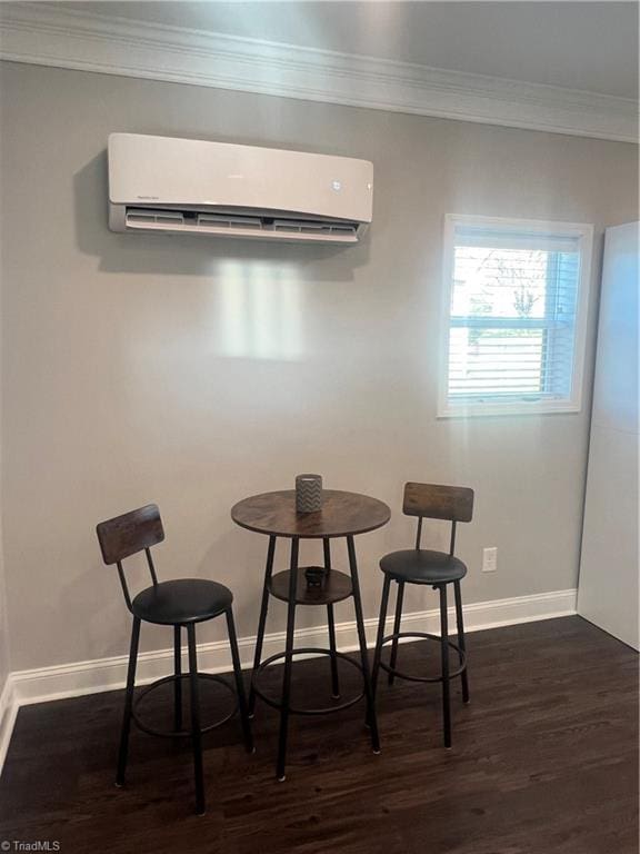 dining space featuring a wall mounted AC, crown molding, and dark wood-type flooring