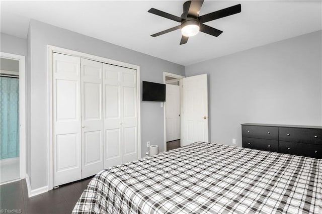 bedroom with ceiling fan and a closet