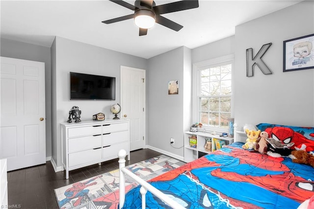 bedroom featuring ceiling fan and dark hardwood / wood-style flooring