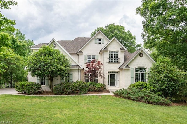 612 Wigeon Dr, Greensboro, NC 27455 - view of front of property with brick siding and a front lawn