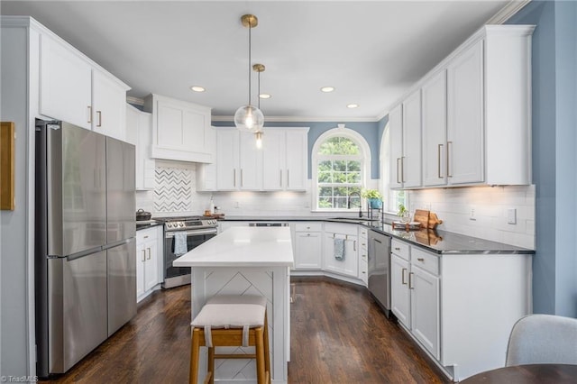 612 Wigeon Dr, Greensboro, NC 27455 - kitchen with stainless steel appliances, a sink, white cabinets, dark wood-type flooring, and recessed lighting