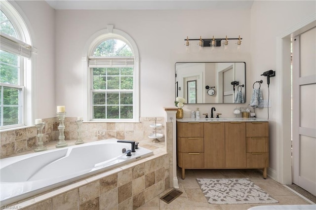 612 Wigeon Dr, Greensboro, NC 27455 - full bathroom featuring a bath, vanity, and tile patterned flooring
