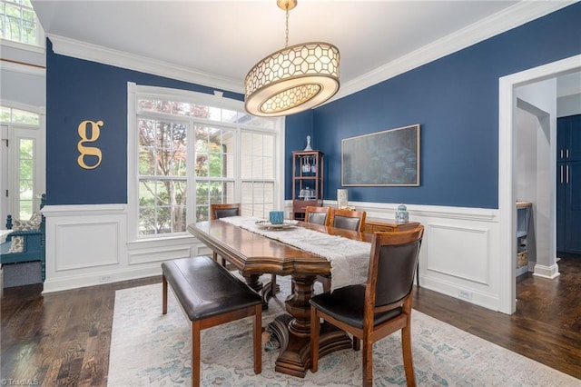 612 Wigeon Dr, Greensboro, NC 27455 - dining room featuring plenty of natural light, wood finished floors, crown molding, a wainscoted wall, and a decorative wall