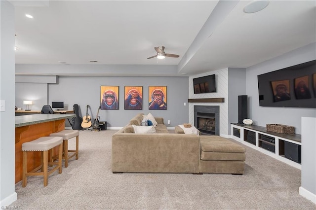 612 Wigeon Dr, Greensboro, NC 27455 - carpeted living area with ceiling fan, a fireplace, an office area, recessed lighting, and baseboards