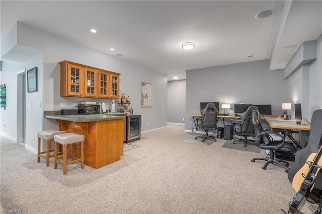 612 Wigeon Dr, Greensboro, NC 27455 - indoor wet bar with wine cooler, light carpet, baseboards, recessed lighting, and black microwave