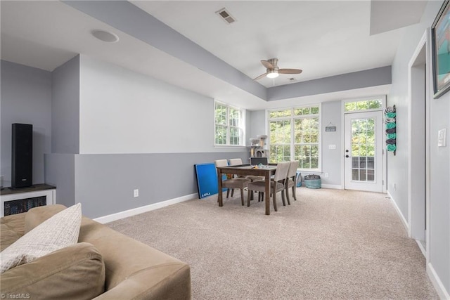 612 Wigeon Dr, Greensboro, NC 27455 - dining room with baseboards, a ceiling fan, and carpet floors