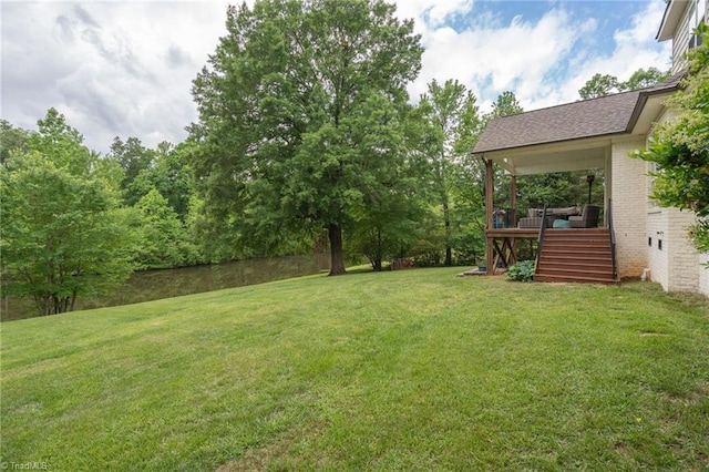 612 Wigeon Dr, Greensboro, NC 27455 - view of grassy yard with stairs and a wooden deck