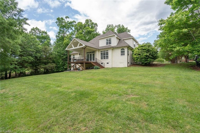 612 Wigeon Dr, Greensboro, NC 27455 - rear view of property with stairway, a lawn, a shingled roof, and a wooden deck