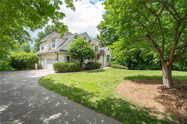 612 Wigeon Dr, Greensboro, NC 27455 - view of front of property featuring driveway, an attached garage, and a front lawn