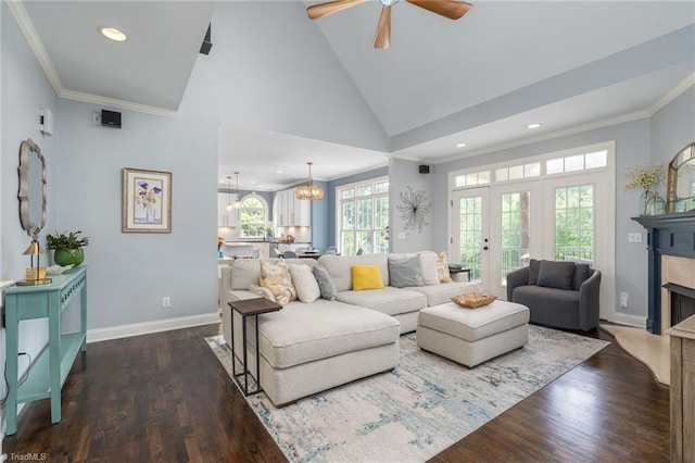 612 Wigeon Dr, Greensboro, NC 27455 - living area featuring dark wood-style floors, a ceiling fan, a premium fireplace, ornamental molding, and baseboards