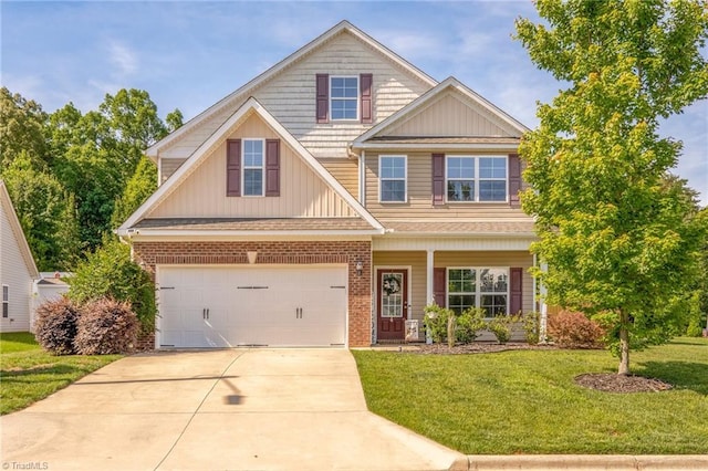 4 Harvest Oak Ct, Greensboro, NC 27406 - view of front of home featuring a garage, a front lawn, driveway, and board and batten siding