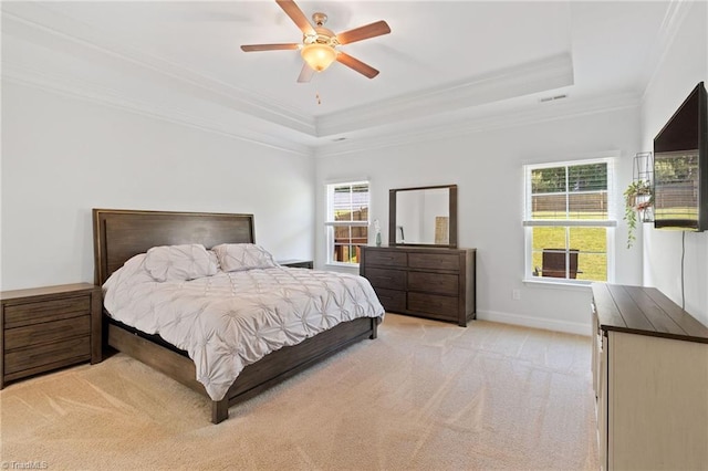 4 Harvest Oak Ct, Greensboro, NC 27406 - bedroom featuring ornamental molding, a raised ceiling, multiple windows, light carpet, and baseboards