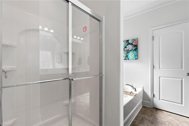 4 Harvest Oak Ct, Greensboro, NC 27406 - bathroom featuring crown molding, a shower stall, a garden tub, wood finished floors, and baseboards