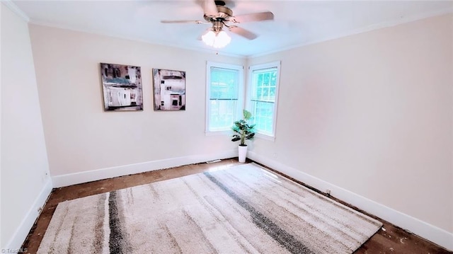 spare room featuring ceiling fan and ornamental molding