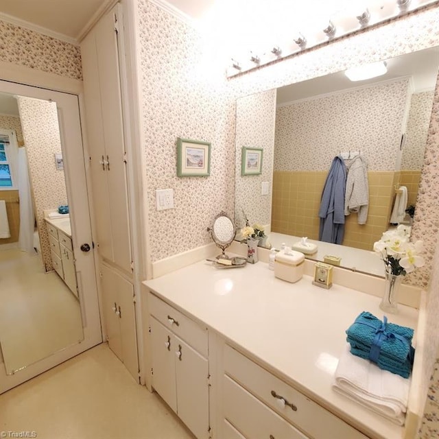 bathroom featuring vanity and ornamental molding