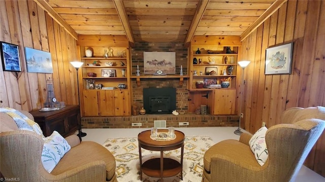 living room with built in shelves, wooden walls, wooden ceiling, beamed ceiling, and a wood stove