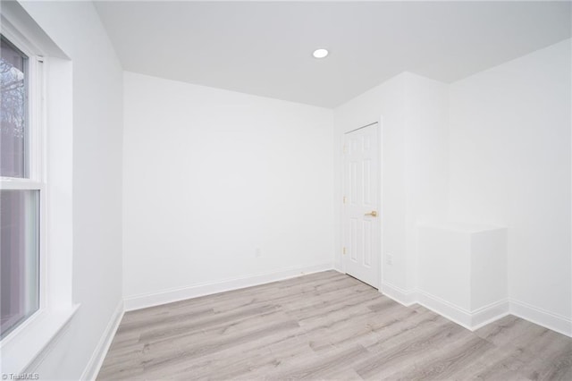 unfurnished room with light hardwood / wood-style flooring