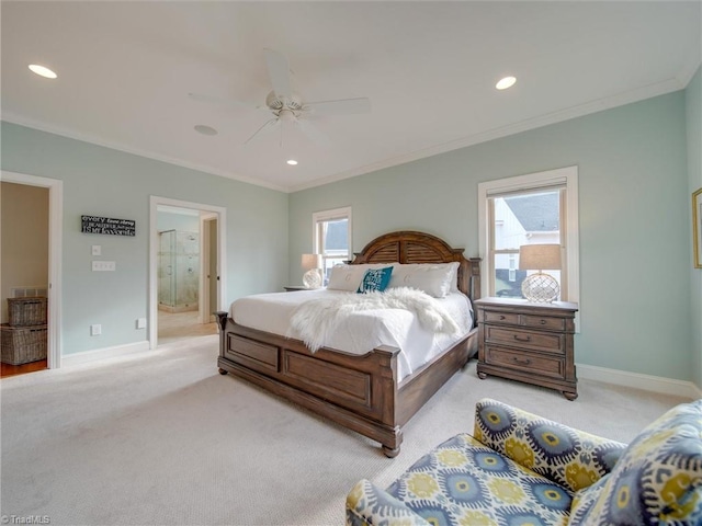 carpeted bedroom featuring connected bathroom, ceiling fan, and ornamental molding