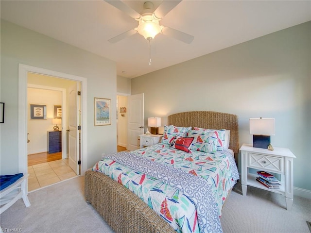 bedroom featuring light colored carpet and ceiling fan