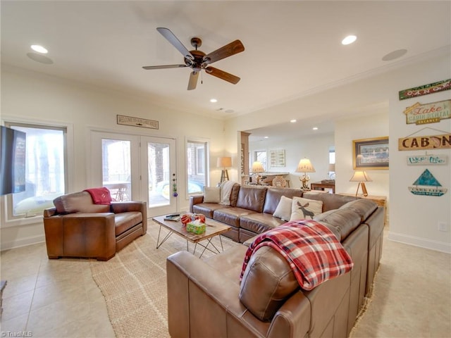 living room featuring ceiling fan, crown molding, light tile patterned floors, and french doors