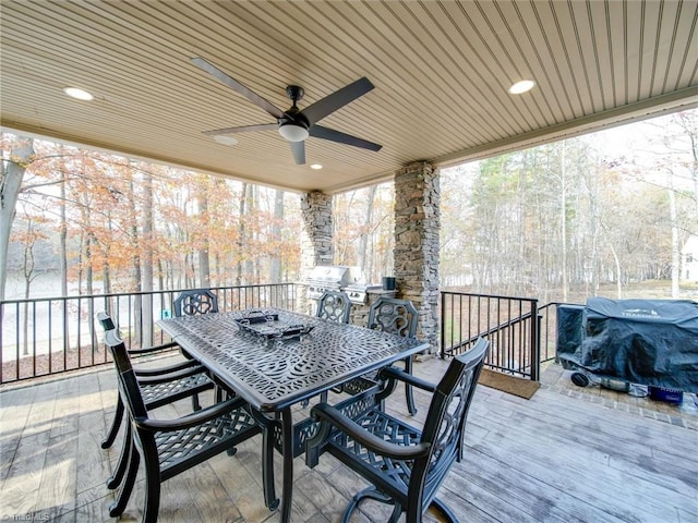 wooden deck with ceiling fan and grilling area