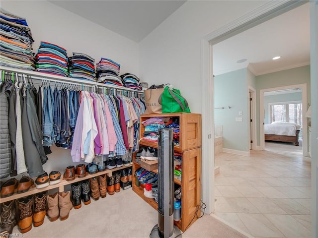 walk in closet featuring light tile patterned floors