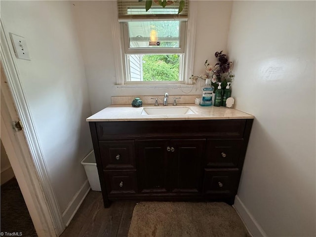 2800 Loch Dr, Winston-Salem, NC 27106 - bathroom with wood finished floors, baseboards, and vanity