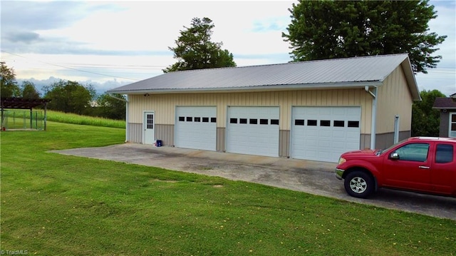 garage featuring a yard