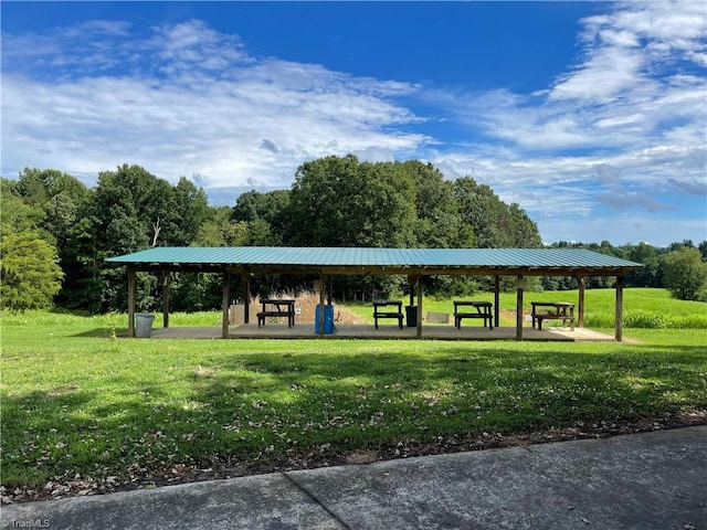 surrounding community with a gazebo and a lawn