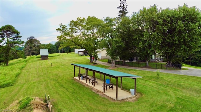 view of property's community with a lawn