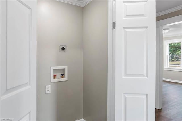 clothes washing area with crown molding, washer hookup, dark hardwood / wood-style floors, and hookup for an electric dryer