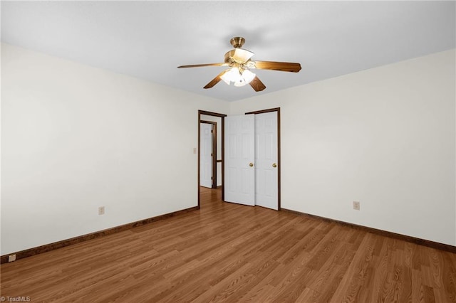 empty room featuring hardwood / wood-style flooring