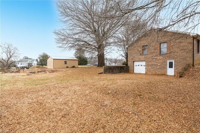 view of yard with a garage