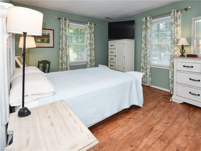 4610 Woodsman Way, Winston-Salem, NC 27103 - bedroom featuring baseboards and wood finished floors