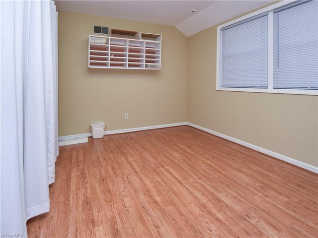 4610 Woodsman Way, Winston-Salem, NC 27103 - spare room featuring wood finished floors and lofted ceiling