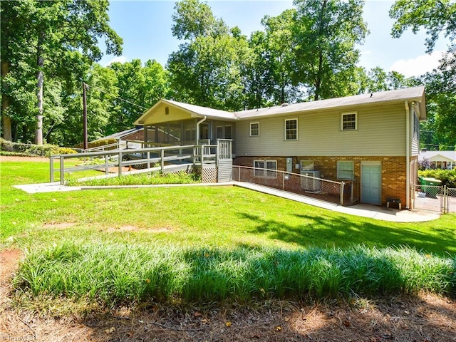 4610 Woodsman Way, Winston-Salem, NC 27103 - rear view of property with a sunroom and brick siding