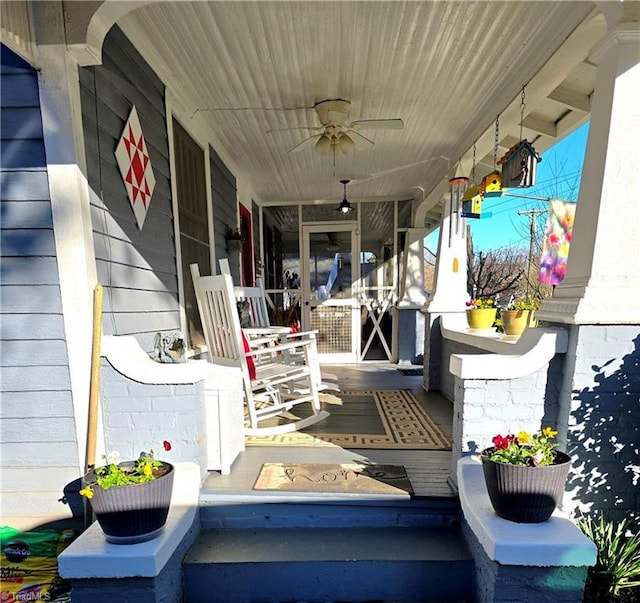 exterior space with a porch and a ceiling fan