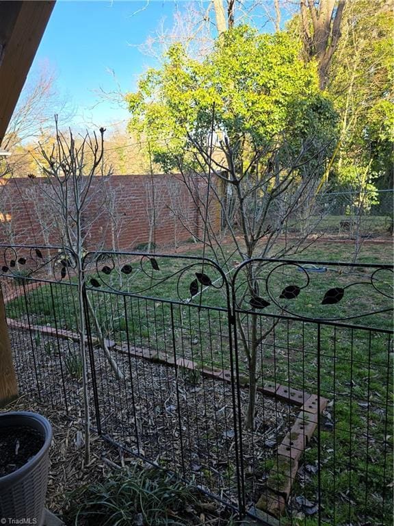 view of gate featuring fence