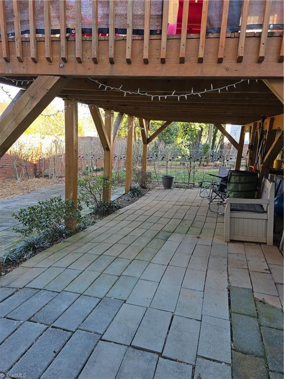 view of patio featuring fence