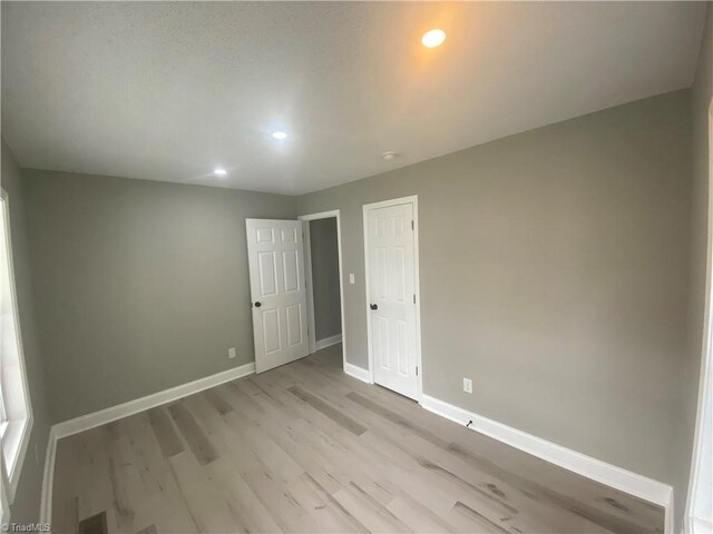 7 Crutchfield Ave, Lexington, NC 28445 - spare room featuring light wood-type flooring, baseboards, and recessed lighting