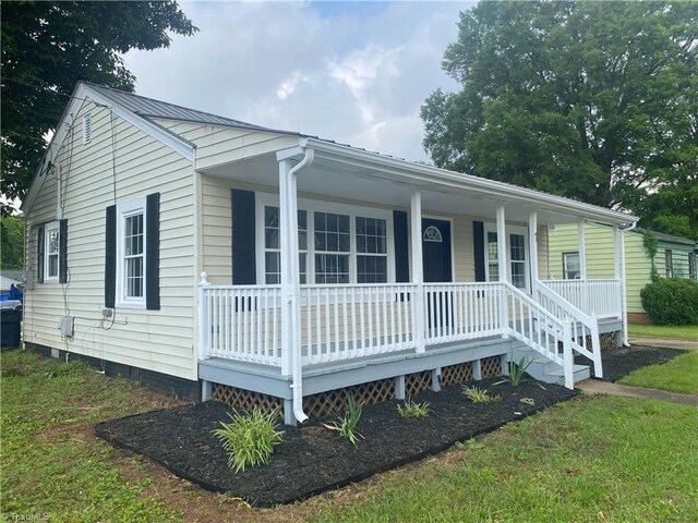 7 Crutchfield Ave, Lexington, NC 28445 - view of front of home with a porch, metal roof, and crawl space