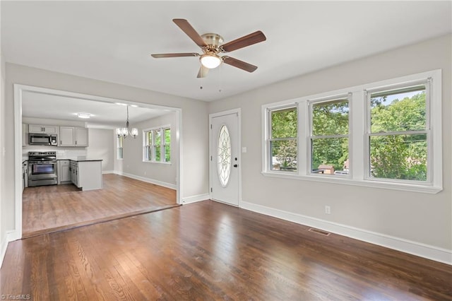 212 Lakeview Dr E, Thomasville, NC 27360 - unfurnished living room with a chandelier, a ceiling fan, and dark wood-style floors