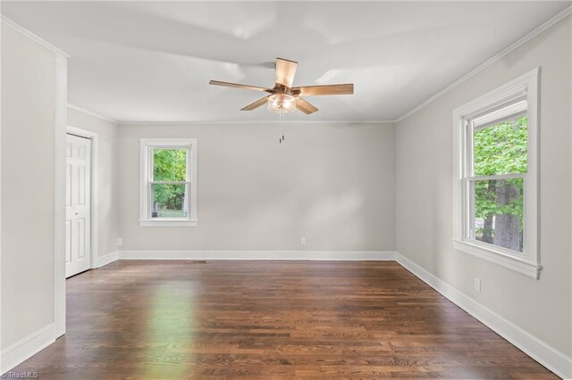 212 Lakeview Dr E, Thomasville, NC 27360 - empty room with healthy amount of natural light, ornamental molding, ceiling fan, and dark wood-type flooring