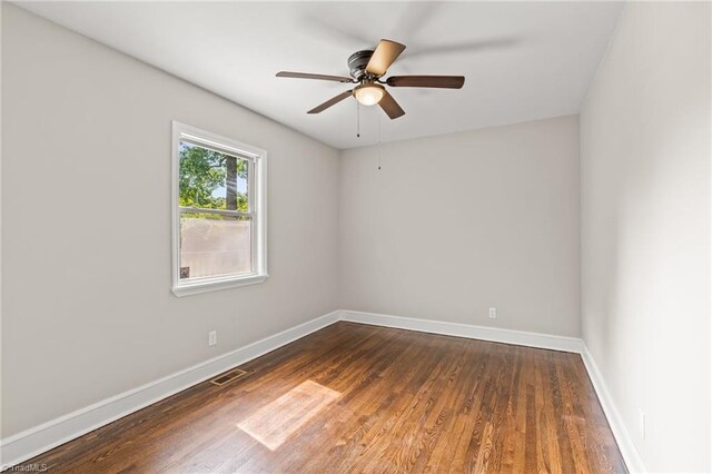 212 Lakeview Dr E, Thomasville, NC 27360 - unfurnished room with wood finished floors and a ceiling fan