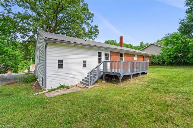 212 Lakeview Dr E, Thomasville, NC 27360 - rear view of property featuring a wooden deck and a chimney