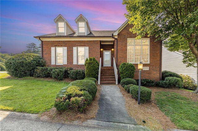 2000 Williamsburg Manor Ct, Winston-Salem, NC 27103 - view of front of home featuring a lawn and brick siding